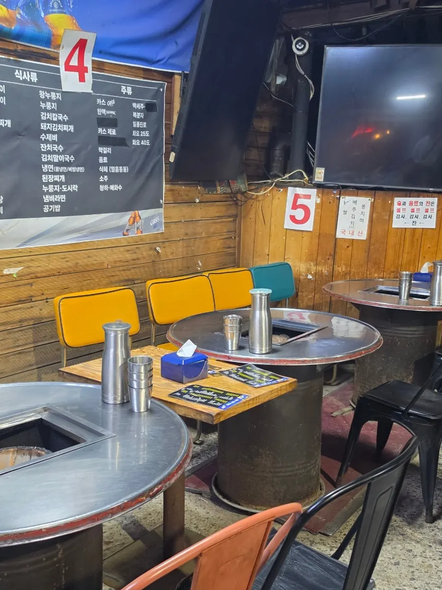 Round drum-can table seating at Yeontan Gongjang