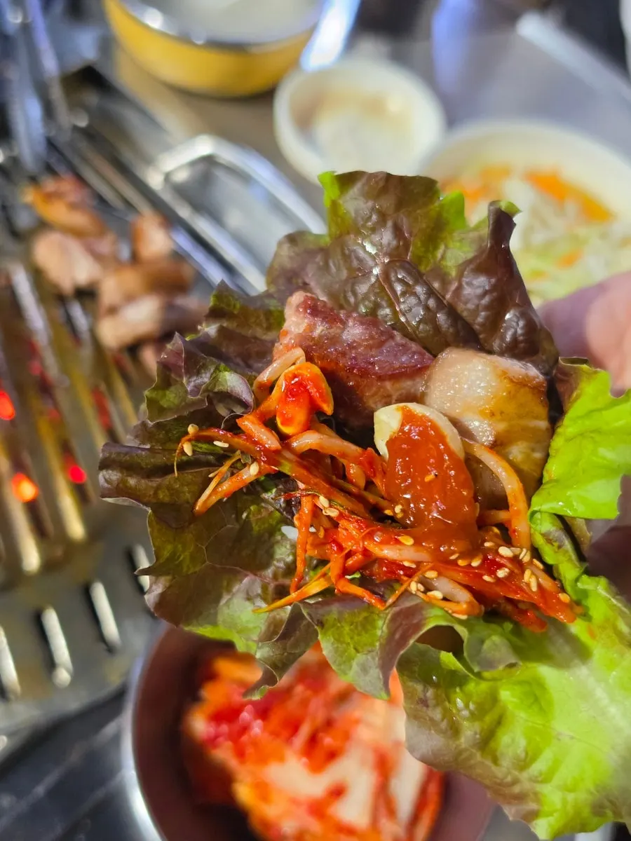 A golden-brown piece of grilled pork neck