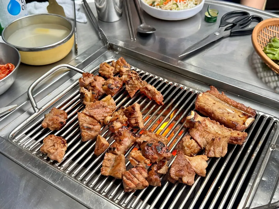 Seasoned pork rib placed on the charcoal fire