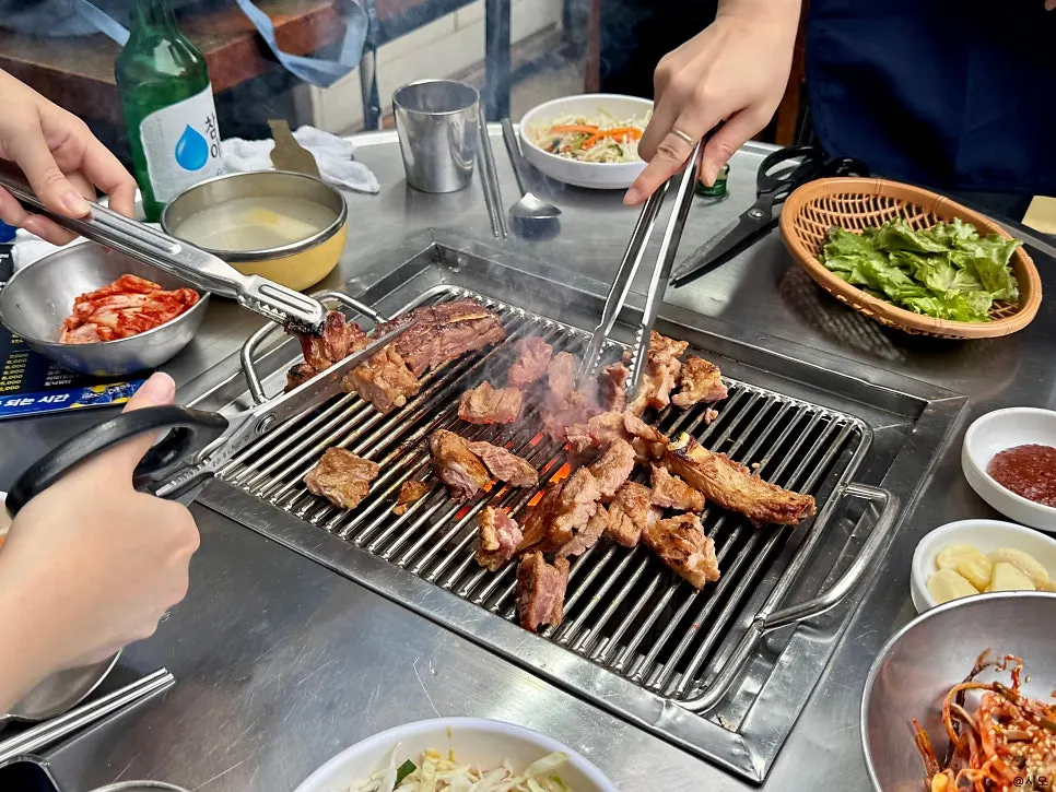 Pork rib cooking on the charcoal brazier