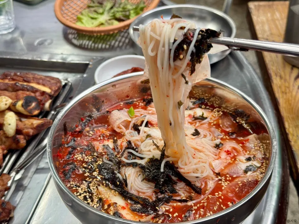 Kimchi noodle soup served in a deep, large bowl