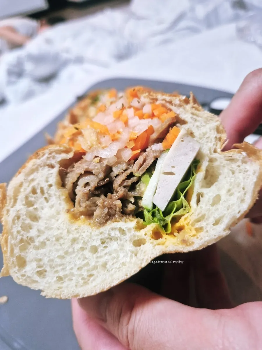 Avocado slices visible inside the banh mi
