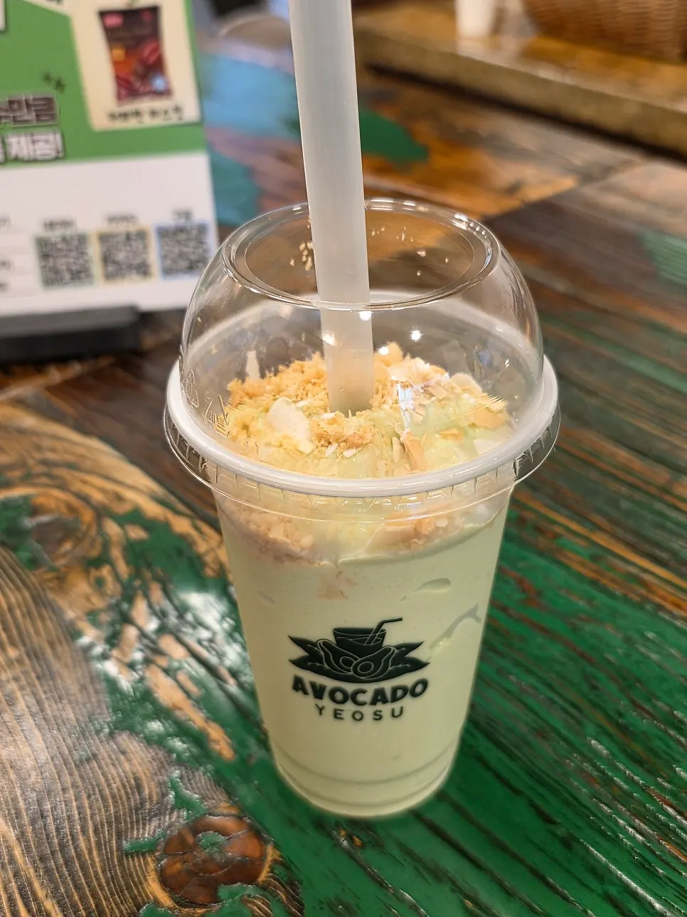 Avocado smoothie topped with coconut chips