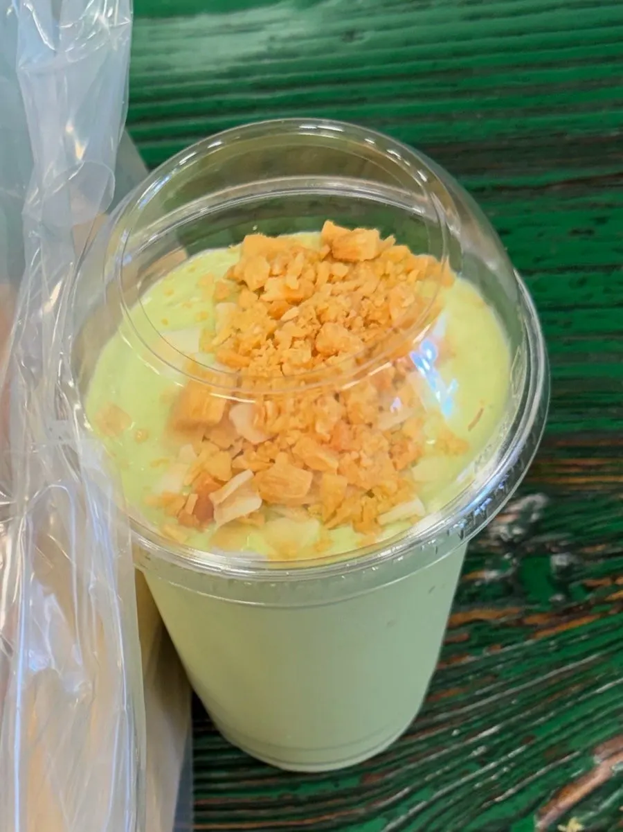 Packaged avocado smoothie and banh mi