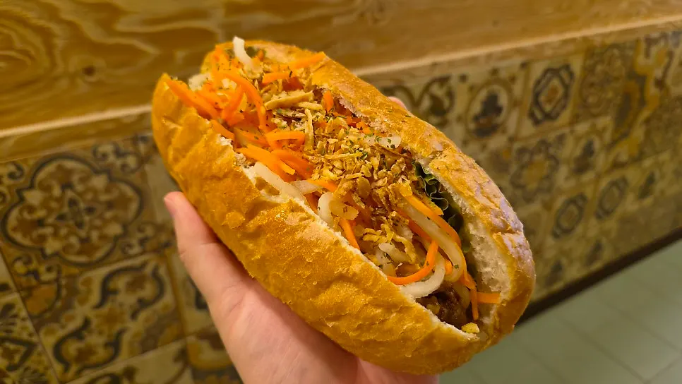 Avocado smoothie and banh mi together on the table