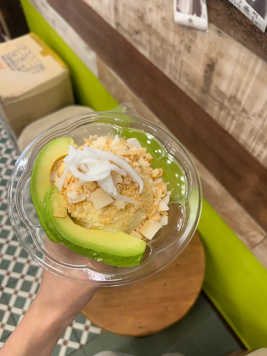 Avocado ice cream topped with coconut chips