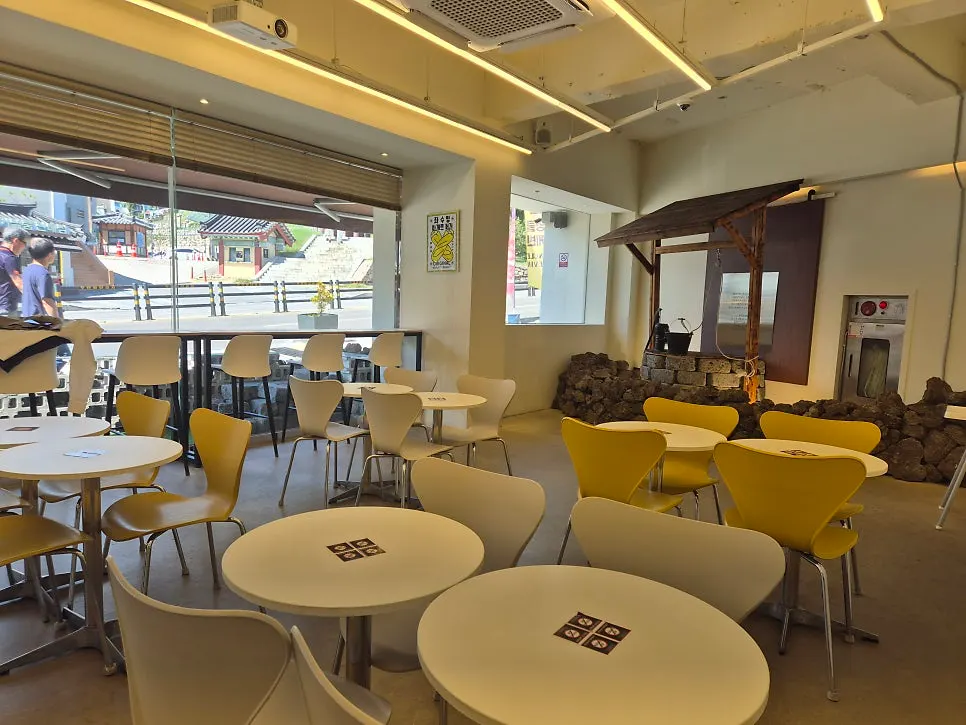 Interior view with tables in front of the counter