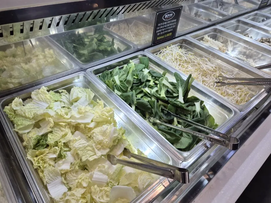 Fresh shabu-shabu vegetables including bean sprouts and bok choy