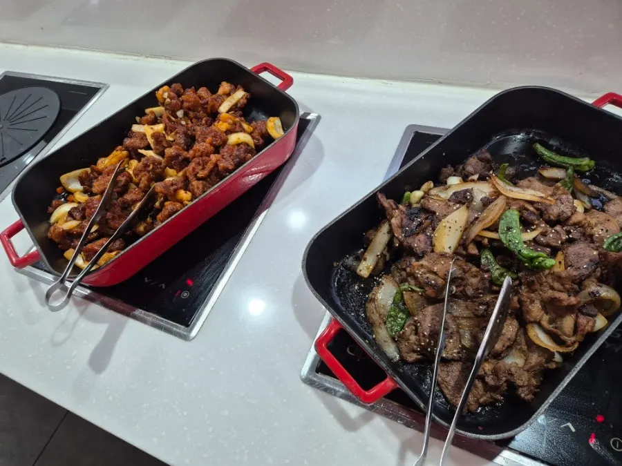 Various dishes displayed at the salad bar