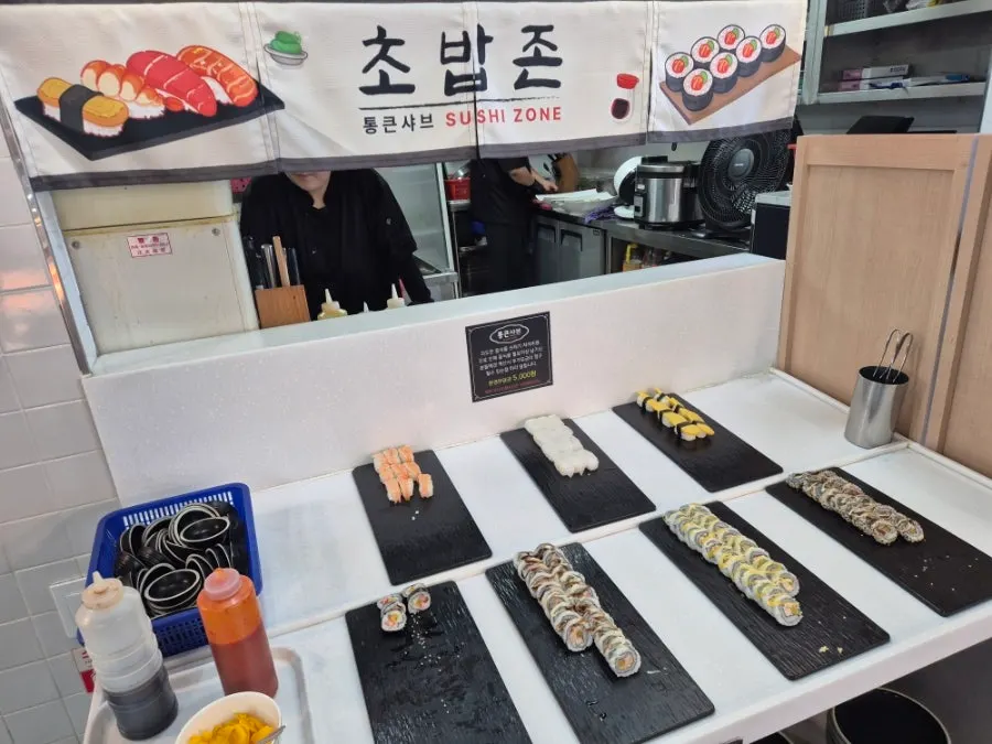 A plate combining sushi and side dishes