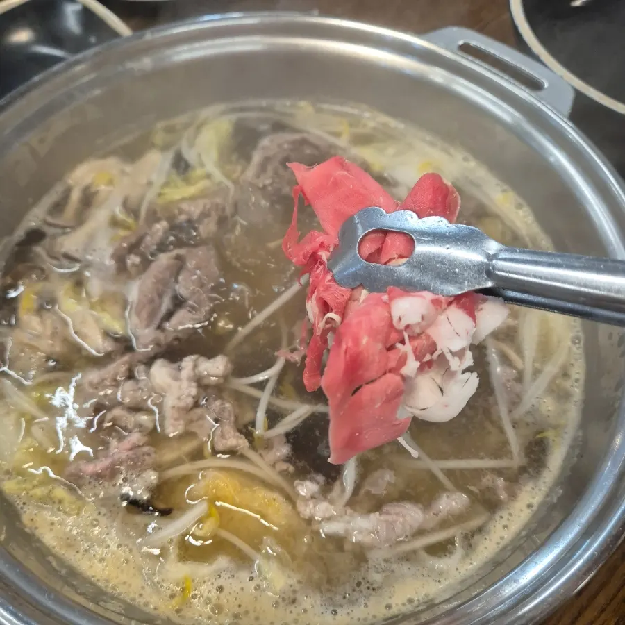 Pot with napa cabbage, bean sprouts, and mushrooms