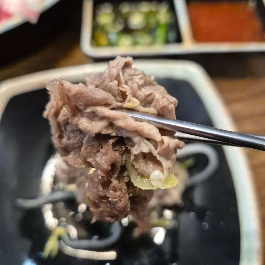 Meat dipped in spicy chili soy sauce