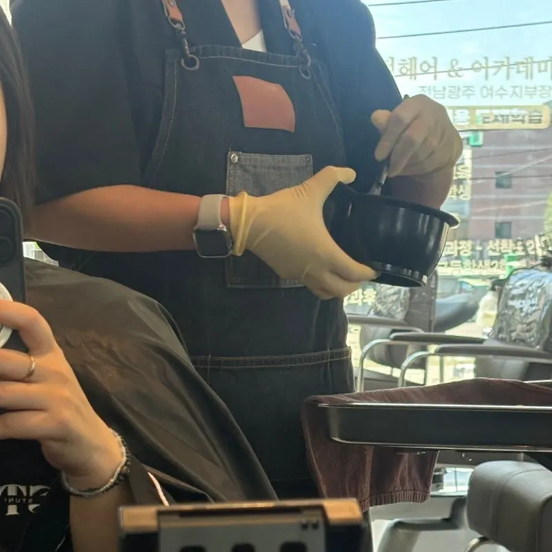 Visible gray hairs and uneven hair color