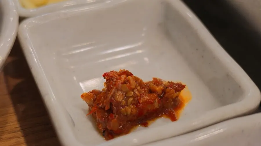 Ssam-mu and scallion salad served alongside the meat