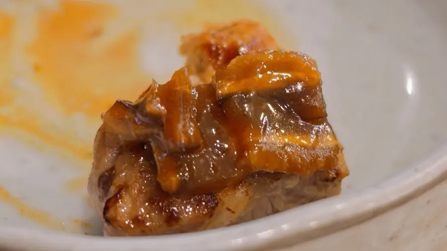 Grilled meat neatly arranged on the grill