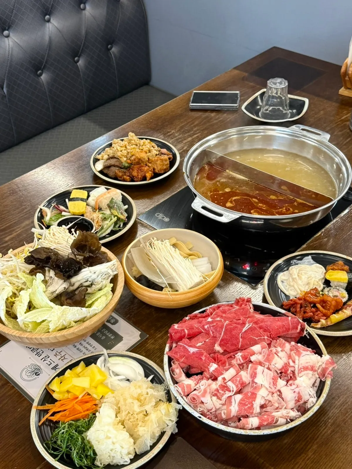 Shabu pot set up with mala half broth