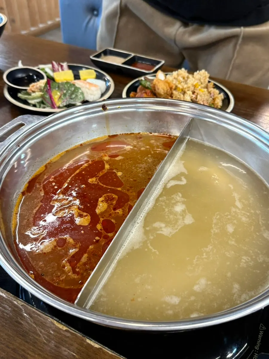 Table full of meat and vegetables for shabu-shabu