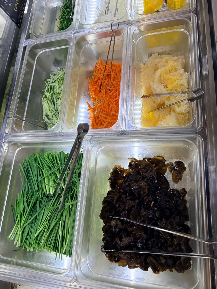 Side dishes and salads laid out at the salad bar