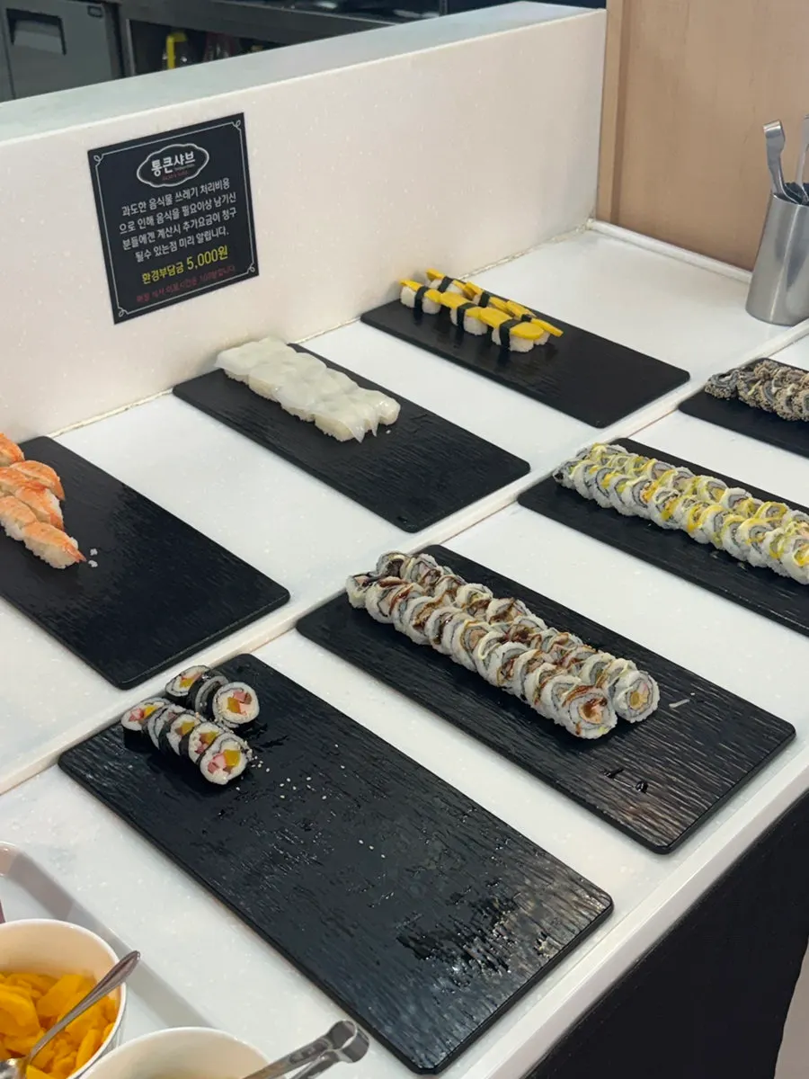Sushi and rolls displayed at the self-bar