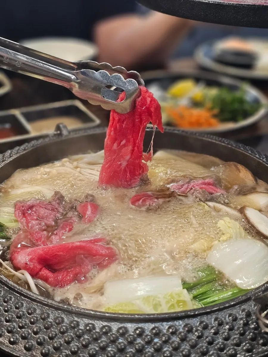 Vertical shot of sukiyaki shabu-shabu at Tongkeun Shabu