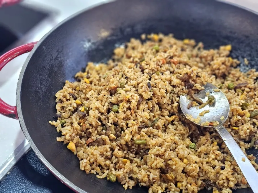 Hot food corner with fried rice and thin-crust pizza