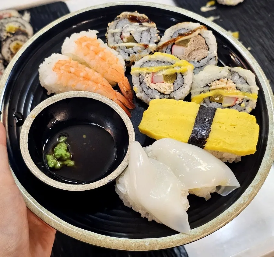 Shrimp, egg and squid sushi with rolled sushi