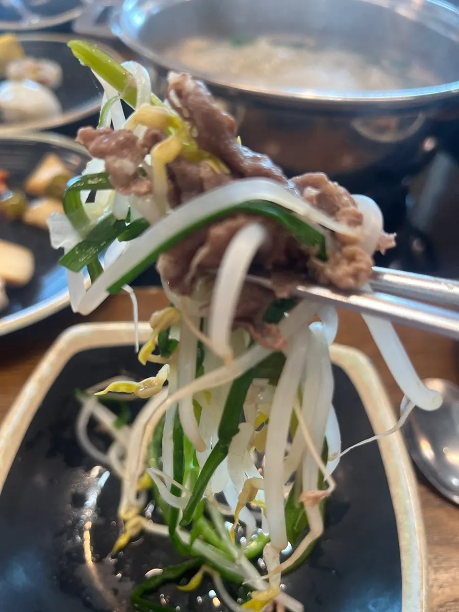 Shabu-shabu meat cooking in the boiling basic broth