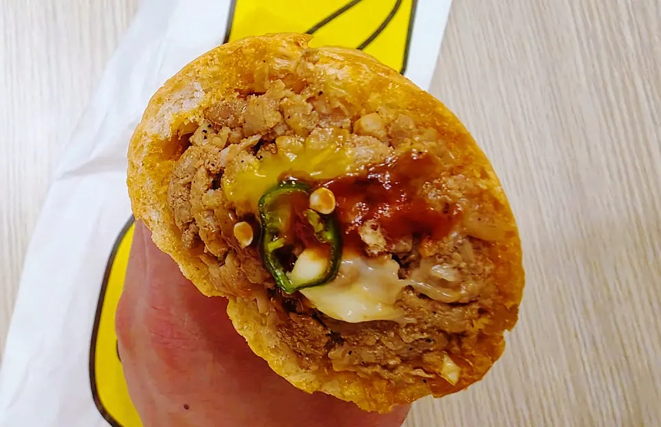 Meat and vegetables inside the baguette burger