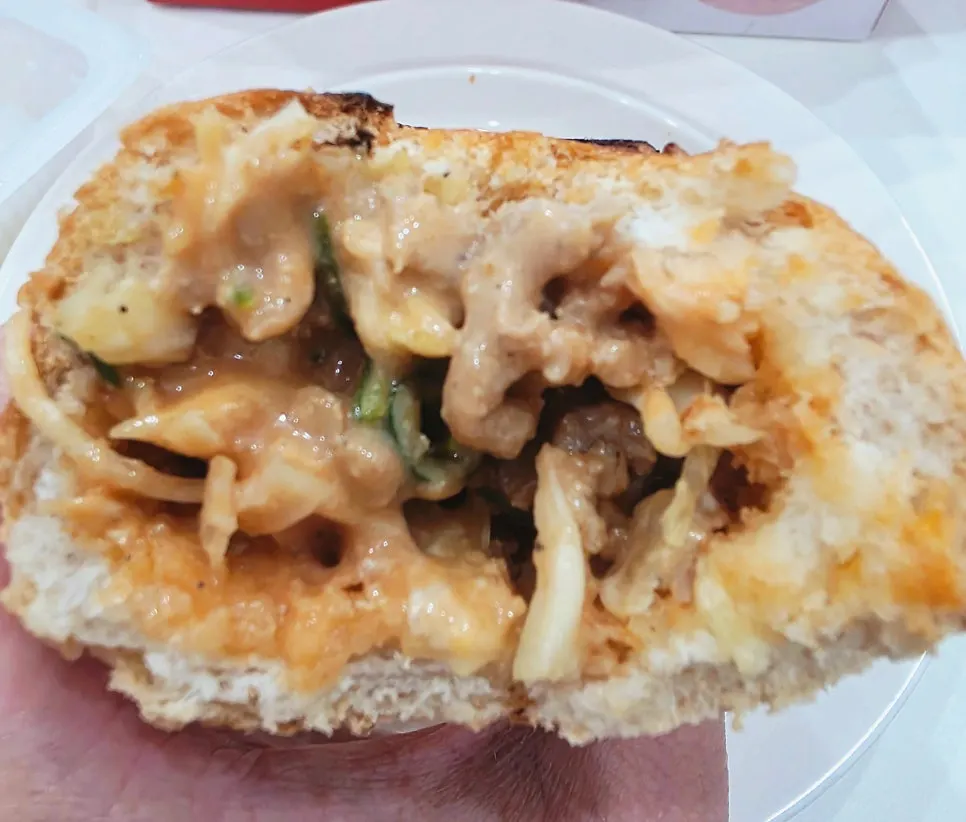 Baguette burger reheated in a frying pan