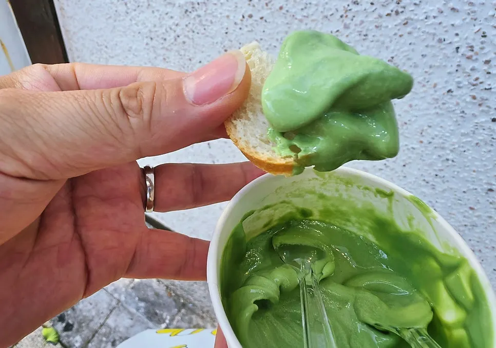 Dipping the baguette burger in mugwort ice cream
