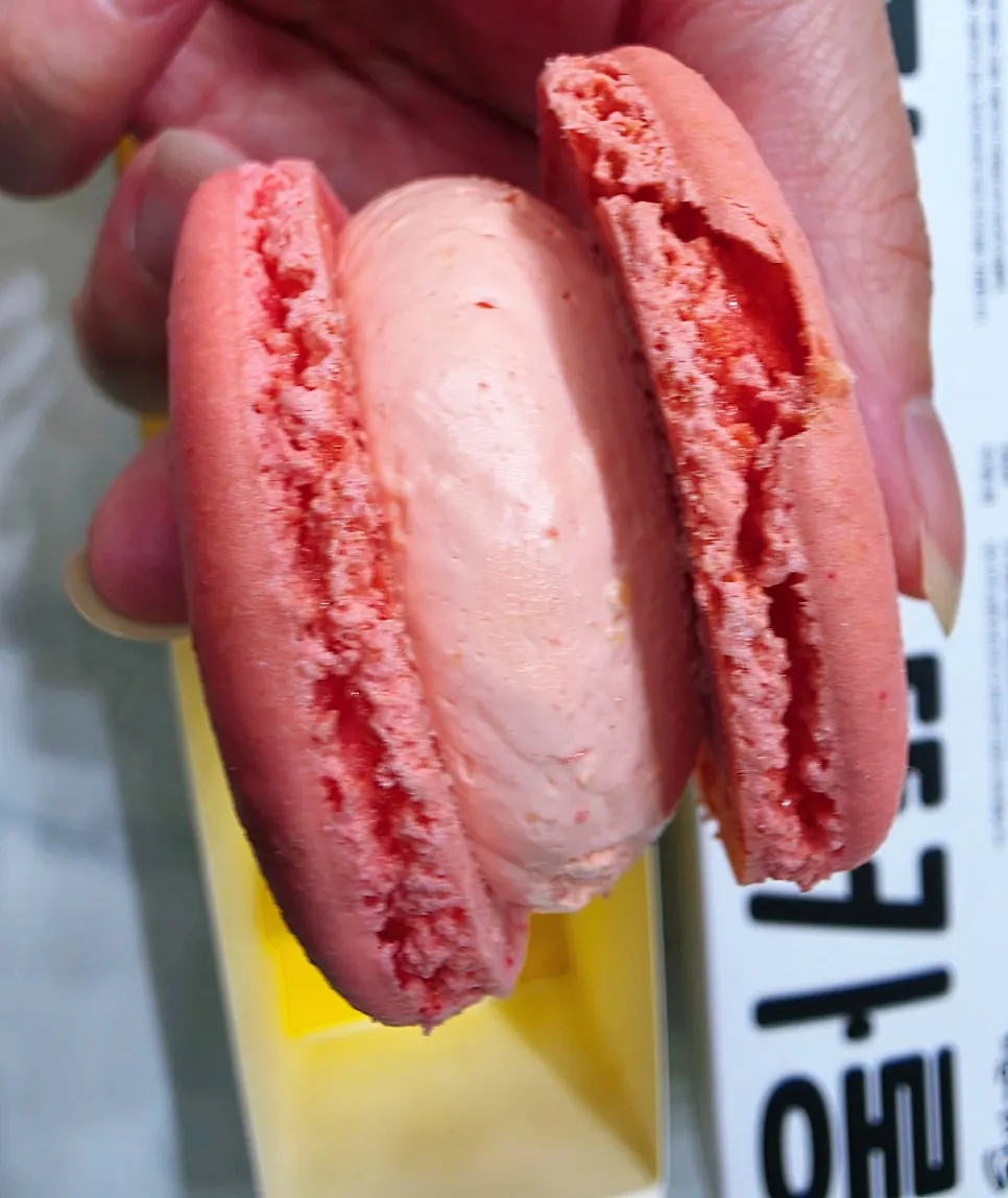 Cross-section of the cookies and cream macaron