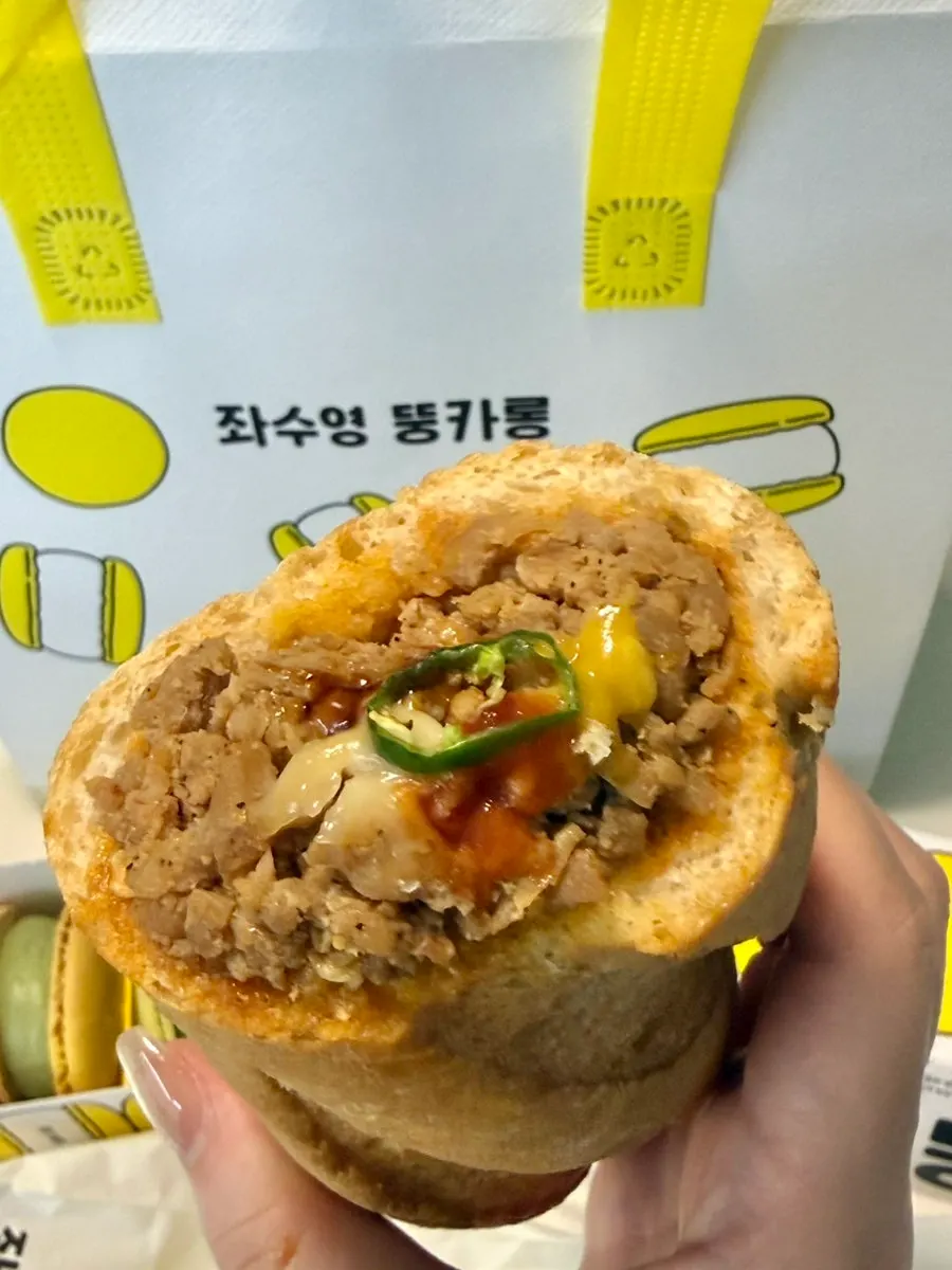 Inside of the baguette burger showing the secret sauce