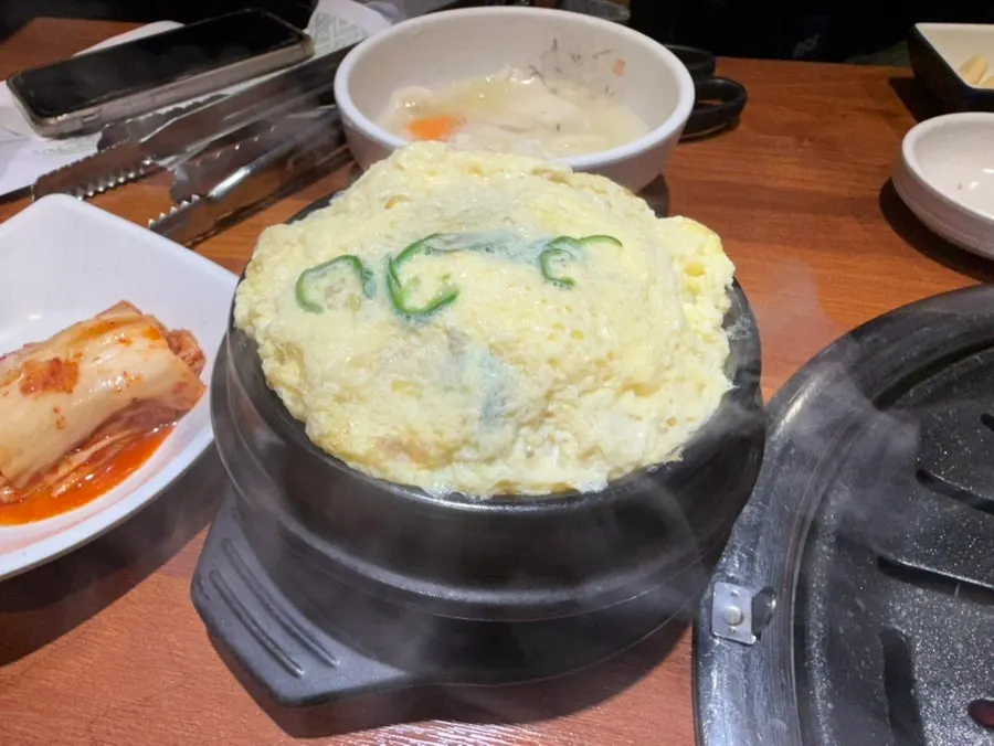 Warm side dishes including corn cheese and chive pancake