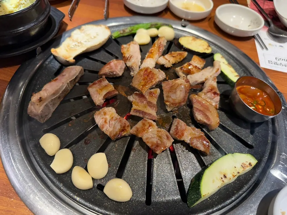 Pork neck and fresh short ribs on the grill