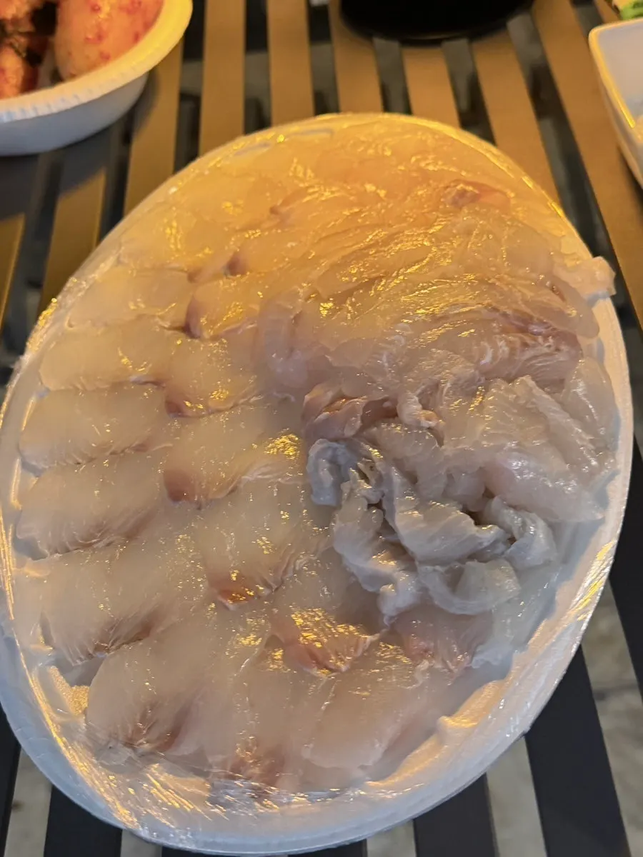 Packed flounder sashimi spread out at the accommodation