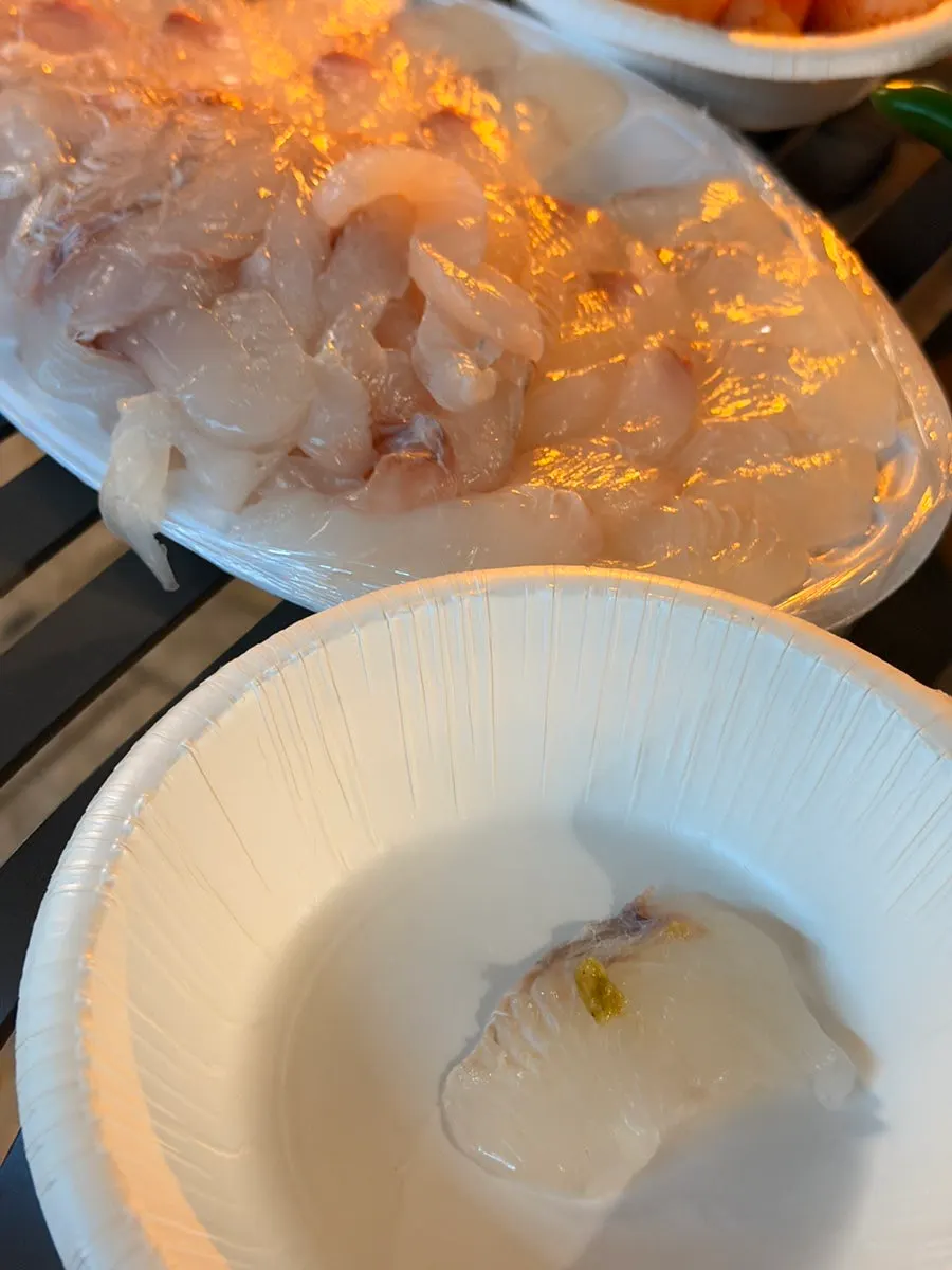 A firm-textured bite of flounder sashimi