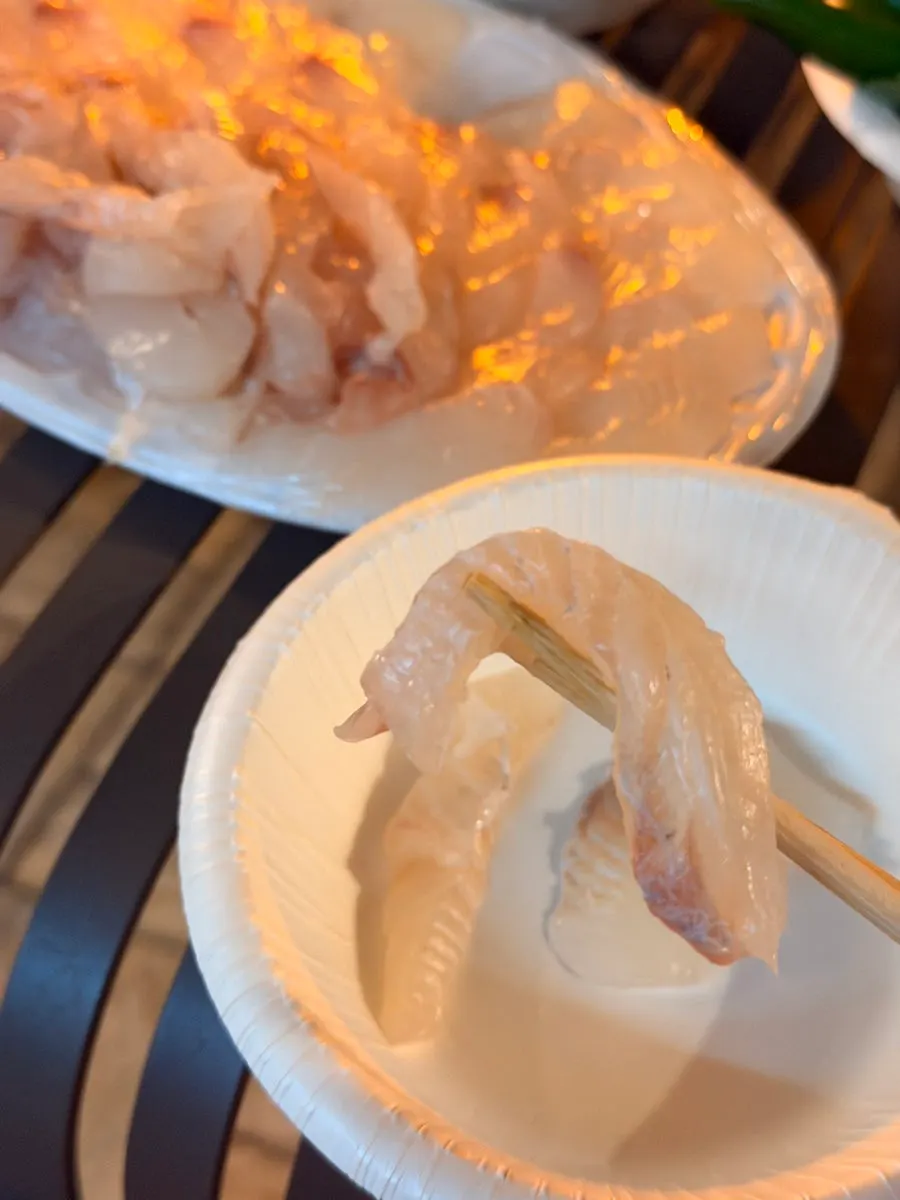 Mix of thin and thick cut flounder sashimi