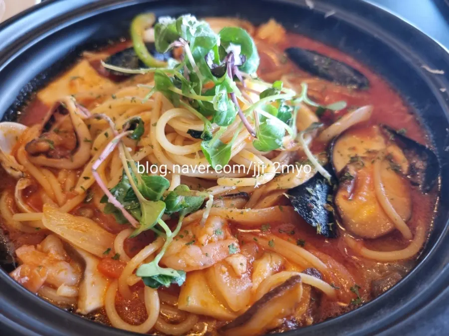 Hot seafood pasta served in a stone pot