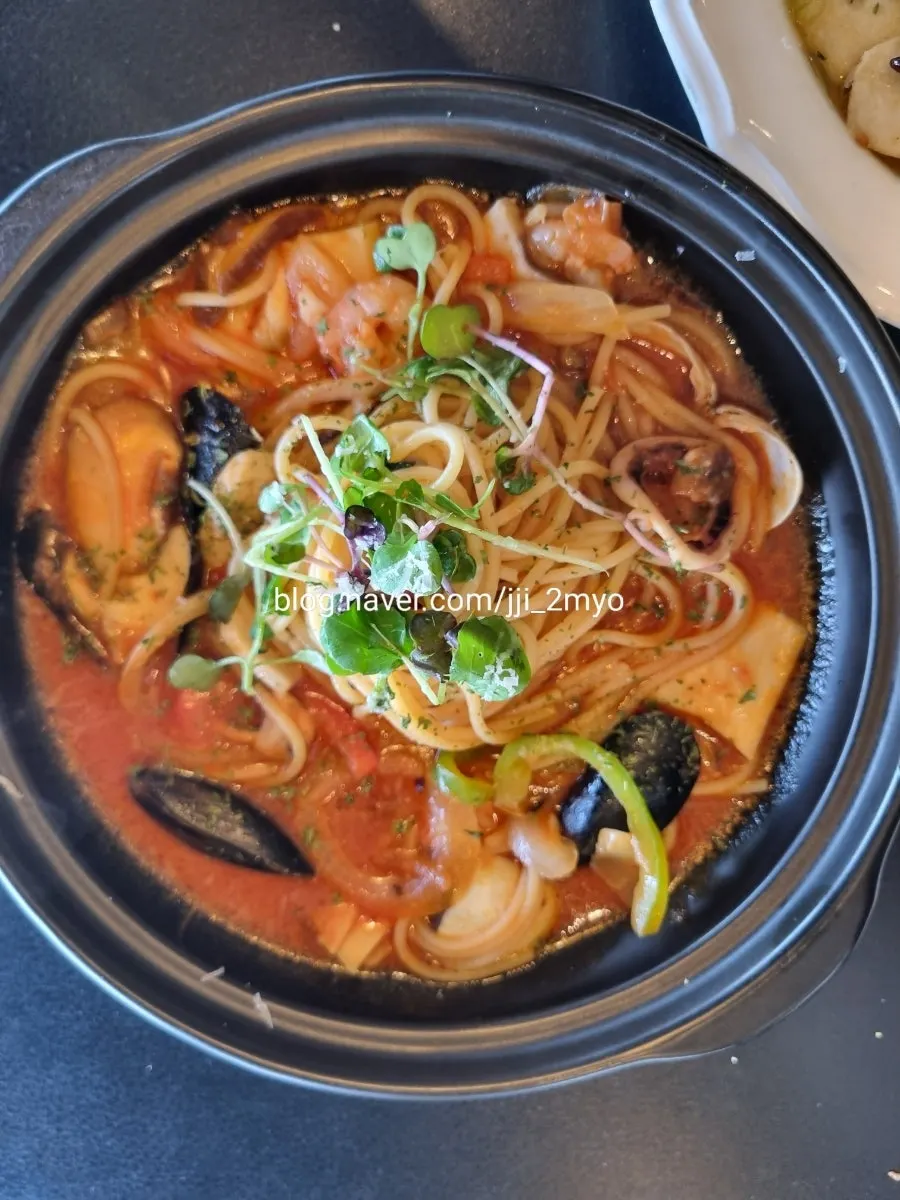 Broth and seafood in the hot seafood stone pot pasta