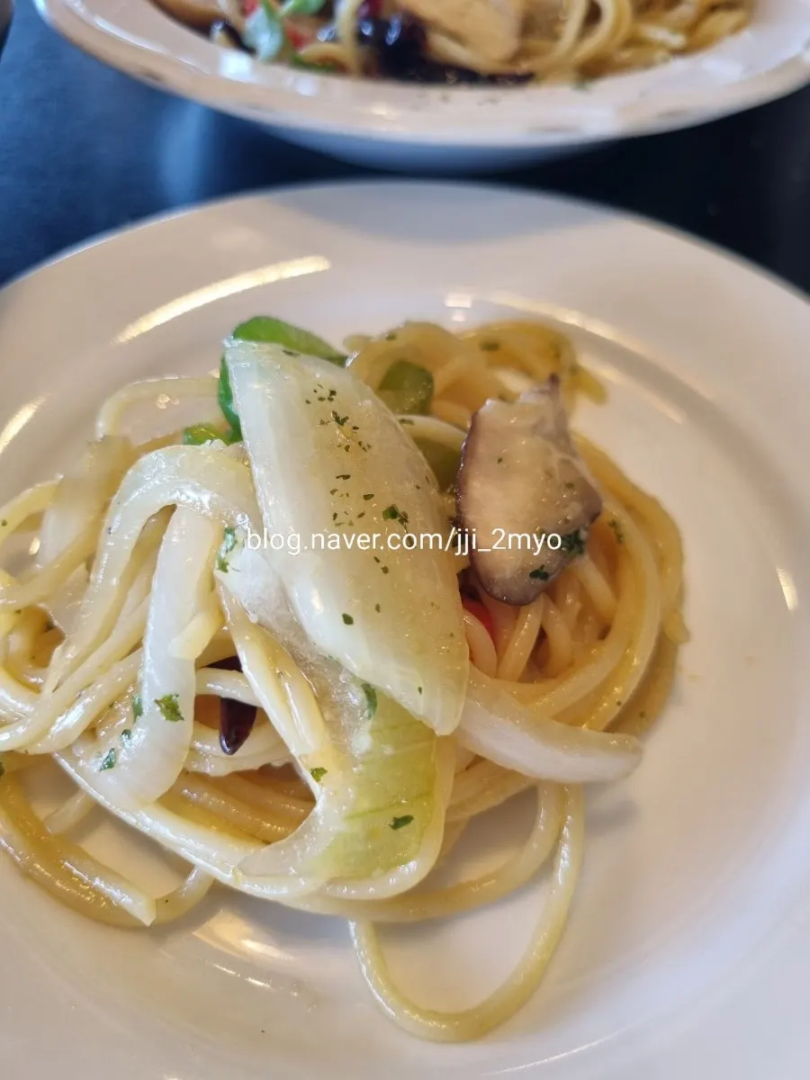 Pasta spread out at the ocean-view window table