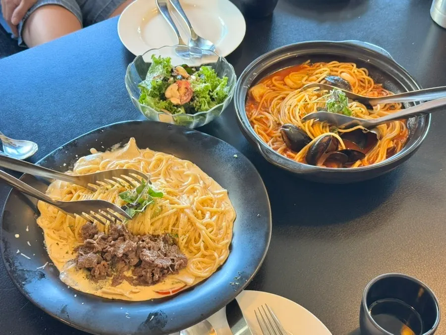 Miso bulgogi pasta topped with bulgogi