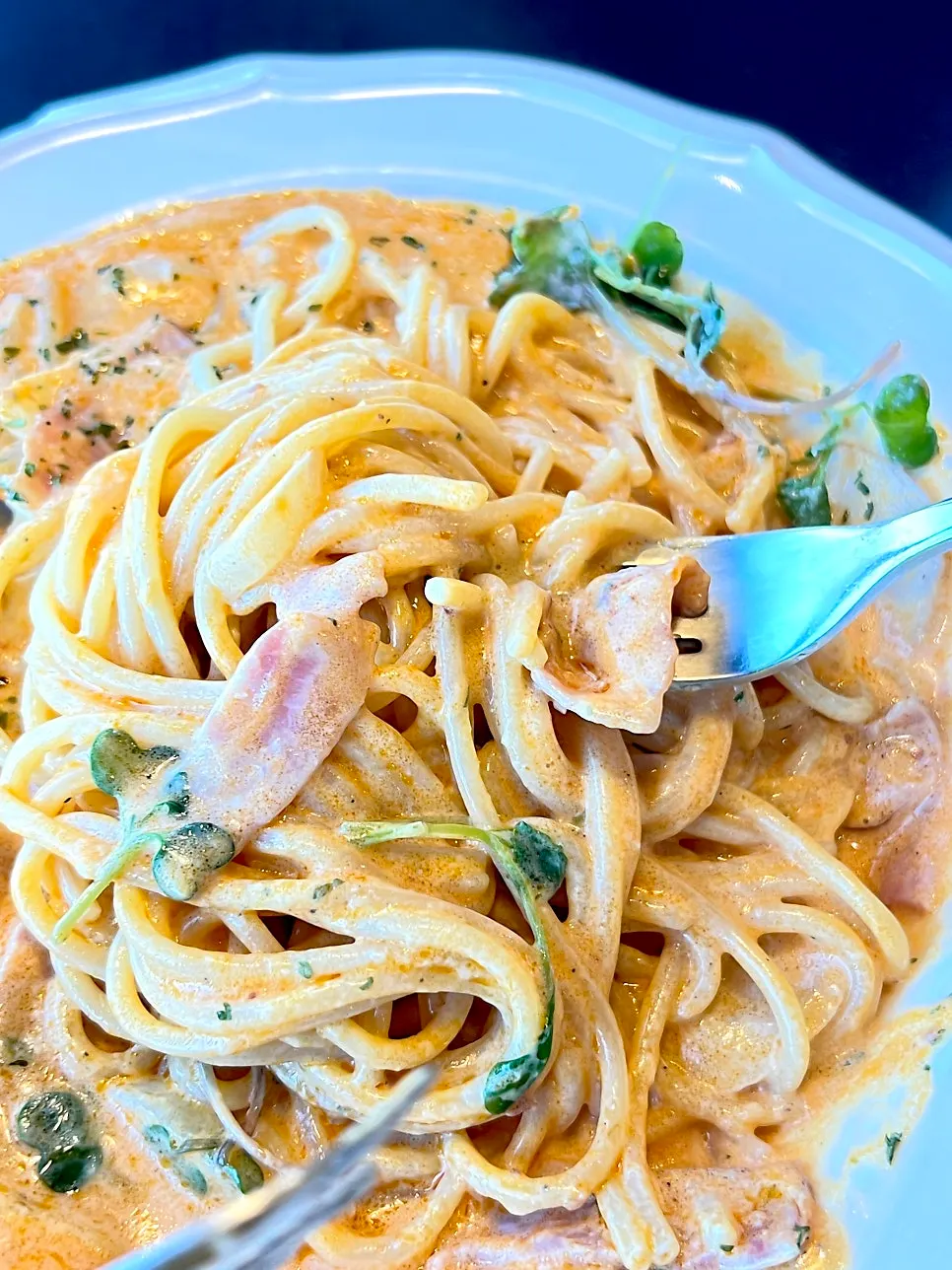 Plump pasta noodles soaked in cream sauce