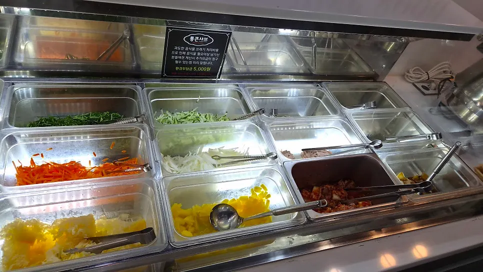 Vegetable corner with napa cabbage, bok choy, bean sprouts, and mushrooms