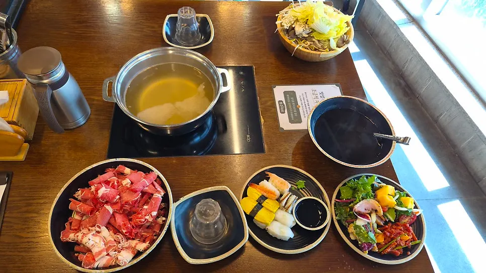 A full shabu-shabu spread on the table