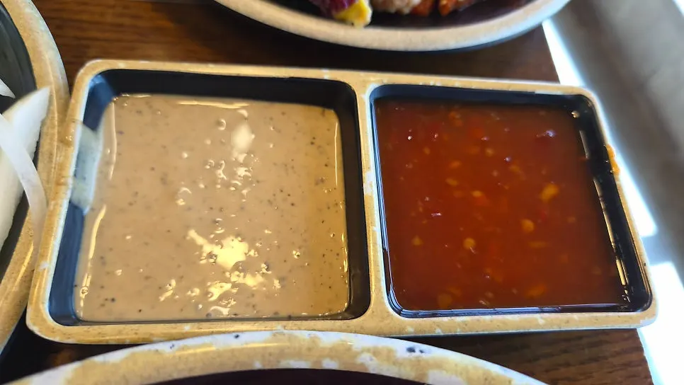 Shabu-shabu meat dipped in sesame and chili sauce