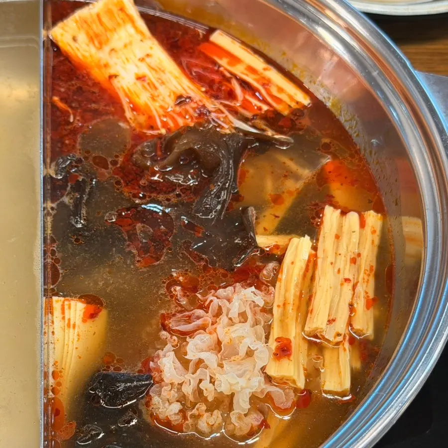Close-up of the richer, deepened mala broth