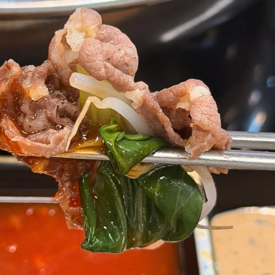 Lightly cooked shabu-shabu meat with chili sauce