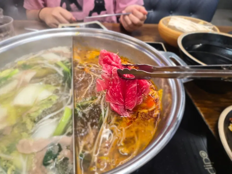 Meat and vegetables cooking in the mala broth