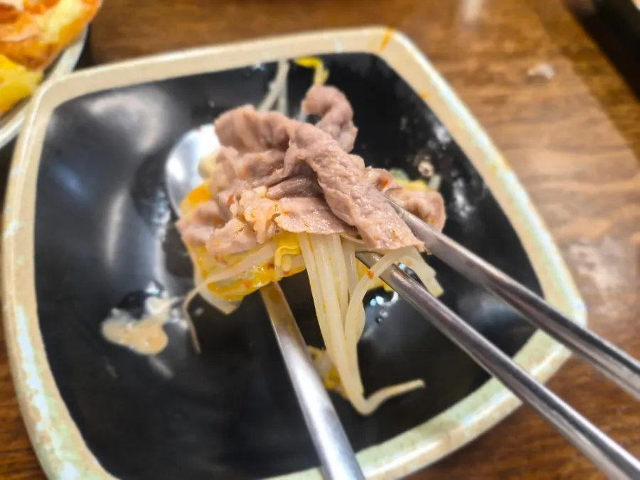 Plate of cooked meat scooped from the pot