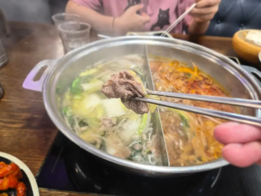Meat and vegetables scooped from the split broth